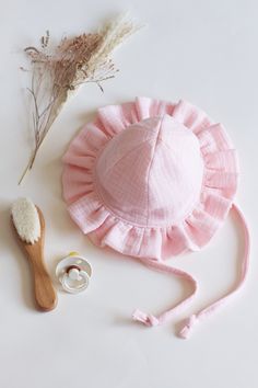 Keep your little ones stylish and protected with our Baby and Toddler Frill Sun Hat. Crafted from lightweight, breathable cotton muslin, this charming hat features a brim with delicate frills for added cuteness. The adjustable chin strap ensures a secure fit, while the breathable fabric offers excellent sun protection. Perfect for sunny days at the beach, park, or any outdoor adventure, this hat is a must-have for every baby's wardrobe. Available in a variety of adorable colours in sizes 0-3 mon Toddler Sun Hat, Girls Sun Hat, Baby Sun Hat, Beach Park, Hat Baby, Baby And Toddler, Cotton Muslin, Pink Baby, Muslin Cotton