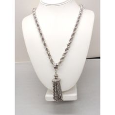 This is part of Chairish’s Costume Jewelry assortment.  Rhodium plated tassel pendant necklace with fold over clasp. Marked "Monet." From Monet's Damita line which was produced from 1960 through the 1970s. Measures 15 inches long total. Pendant with bale measures: 3 3/4 inches long by 1 inch wide. Chain doubled measures: 11 3/4 inches. Excellent condition. A goldtone version of this necklace is shown on pg. 186 of Alice Vega's book "Monet: The Master Jewelers." Elegant Metal Tassel Necklace, Elegant Silver Metal Tassel Necklace, Luxury Formal Tassel Jewelry, Elegant Silver Rope Chain Necklace, Elegant Silver Necklace With Rope Chain, Silver Metal Necklaces With Tassels, Elegant Sterling Silver Rope Chain Necklace, Silver Metal Necklace With Tassels, Elegant Silver Dangle Tassel Necklace