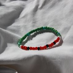 This Watermelon Bracelet is sure to bring a touch of summertime style to any outfit. Crafted from clay beads, it has a unique watermelon inspired design. Its small size makes it a great accessory for any occasion. Casual Summer Bracelets With Tiny Beads, Casual Tiny Beads Bracelets For Summer, Green Bohemian Stretch Bracelet For Everyday Wear, Casual Colorful Beaded Bracelets For Summer, Casual Tiny Beads Bracelet For Summer, Summer Casual Beads As Gifts, Casual Summer Beaded Bracelets With Round Beads, Casual Summer Bracelets With Round Beads, Everyday Summer Beaded Bracelets