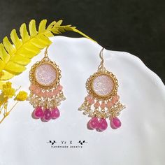 ♢ FEATURES & MATERIALS ~Cameo:pink mother of pearl,natural color,hand carved,15mm ~Pink Sapphire: natural color,9-10mm ~Rhodochrosite:natural color,3mm ~Pearl:natural color,2-3mm ~Materials: 14K Gold Filled This pair of gorgeous pink mother-of-pearl Cameos are hand-carved with vintage patterns. I paired them with pink sapphire droplets, rhodochrosite and freshwater pearls, which are exquisite and retro. All metals are filled with 14K gold filled and will not cause skin irritation. Length of earr Pink Teardrop Chandelier Earrings, Pink Pierced Earrings As Gift, Pink Earrings For Valentine's Day Celebration, Elegant Pink Earrings For Festive Occasions, Pink Teardrop Chandelier Earrings For Gift, Handmade Pink Earrings For Party, Pink Chandelier Drop Earrings For Gift, Pink Round Earrings For Valentine's Day, Pink Bohemian Jewelry For Valentine's Day