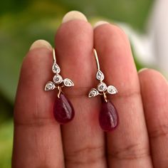 A perfect pair for your big day or the most important ladies of your tribe, these pretty earrings feature a cluster of diamond studded leaves with a Natural Ruby Drop * Diamond Wt. : 0.20 Cts * Color-Clarity Grade : H-I, VS Si * Ruby : 7 ct ( Approx) * Gold - 14K, 1.6 gms yellow gold (for other metal color, please convo) Find us on Instagram for exquisite designs: @abhikajewels Like us on Facebook: www.facebook.com/Abhikajewels Thank you for visiting our shop.. :) Fine Jewelry Hand Set Teardrop Diamond Earrings, Fine Jewelry Dangle Earrings With Single Cut Diamonds, Hand Set Teardrop Diamond Earrings, Diamond Briolette Earrings For Wedding, Diamond Briolette Earrings For Anniversary, Dangle Diamond Gemstone Earrings For Anniversary, Elegant Ruby Earrings With Rose Cut Diamonds, Anniversary Dangle Diamond Earrings With Gemstone, Dangle Diamond Earrings With Single Cut Diamonds For Wedding