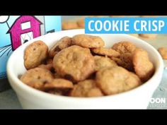 a bowl filled with cookies next to a box of cereal