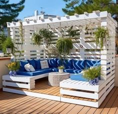 an outdoor living area with blue and white furniture