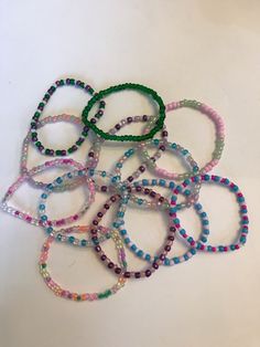 This listing is a bracelet set of one. There are 12 options to chose from varying from neutral to bold aesthetics. It is 7 inches long and is stretchy for easy on and off. If you buy multiple they are easily stacked and are a perfect addition to any outfit. Hope you enjoy! Trendy Adjustable Stretch Bracelet With Tiny Beads, Trendy Inelastic Bracelets With Round Beads, Trendy Flexible Jewelry With Colorful Beads, Trendy Beaded Bracelets For Everyday, Trendy Everyday Beaded Bracelets With Round Beads, Multicolor Stretch Beaded Jewelry, Casual Stackable Stretch Bracelet For Friendship, Trendy Hypoallergenic Beaded Bracelets, Trendy Everyday Beaded Bracelets