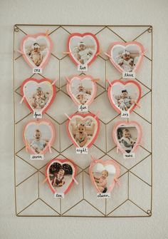 a heart shaped photo frame with many pictures on it