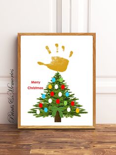 a christmas tree with handprints on it