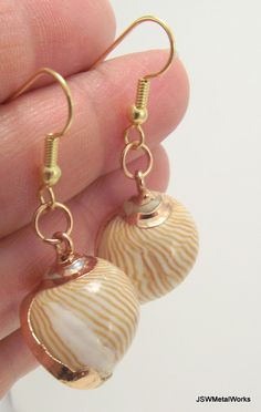 Gold Snail Shell Earrings, Beach Jewelry Gold Earrings, Organic Earrings Gold Drop Earrings For Vacation, Gold Shell Dangle Earrings, Vacation Shell-shaped Earrings With Ear Wire, Gold Shell With Matching Earrings, Gold Nickel-free Earrings For Vacation, Nickel-free Gold Earrings For Vacation, Gold Dangle Earrings For Beach, Elegant Gold Earrings For Vacation, Beachy Gold Dangle Earrings