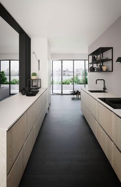 an empty kitchen with black and white accents