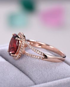 "8x10mm oval cut Garnet ring in 925 sterling silver. White/yellow/rose gold plated. The stones of the ring can be replace with other different kinds of gemstone such as morganite, aquamarine, amethyst, citrine, white CZ, pink CZ,etc. If there isn't the gemstone that you want in the \"Gemstone\" option, please feel free to contact with me. ♥ PS: When you order the ring , the default color of gold plated is what it show in the photo. If you want the other color of gold plated, please leave a messa Garnet Engagement Ring, Wedding Anniversary Gift, Split Shank, Garnet Rings, Cz Diamond, Ruby Ring, Diamond Halo, Wedding Anniversary Gifts, Silver Rose Gold