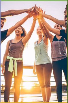 a group of people holding their hands up in the air with text overlay that reads,