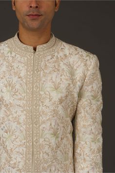 Editor's Note Ivory Matka Silk Sherwani With Silk Lining Has Resham & Hand Embroidery Work Note: Churidar worn by model is for styling purposes. Color: Ivory Fabric: Silk Components: Sherwani Care: Dry Clean Only About the Designer Rohit Bal is intensely concerned with design as an art form. The designer draws on history, fantasy and folklore to create masterpieces that are desired by discerning aficionados around the globe. Rohit has a deep understanding of the psyche of the fashion world and i Semi-stitched Cream Kurta With Zari Work, Elegant Multicolor Embroidery Sets For Reception, Cream Embroidered Sets With Traditional Drape, Designer Cream Sets With Traditional Drape, Off White Sets With Zari Work For Transitional Season, Off White Embroidered Sets For Transitional Season, Off White Sets With Intricate Embroidery For Transitional Season, Traditional Drape Sets With Floral Embroidery In Cream, Embroidered Fitted Sherwani For Reception