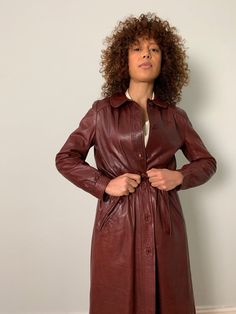 Discover timeless sophistication with our Leather Trench Coat for Women, a stunning piece that effortlessly blends vintage charm with modern style. Crafted from genuine sheepskin leather, this long brown coat exudes elegance and durability. Featuring a belted design inspired by 90s Boho fashion, it adds a touch of retro flair to any ensemble. Perfect for spring, its soft and supple leather ensures comfort without compromising on style. Elevate your wardrobe with this statement trench coat that p Vintage Leather Jacket With Long Sleeves For Fall, Vintage Outerwear For Fall, Vintage Long Sleeve Leather Jacket For Fall, Retro Fall Outerwear For Vintage Fashion, Fall Vintage Outerwear, Fall Vintage Fashion Single-breasted Outerwear, Vintage Brown Leather Jacket For Fall, Vintage Brown Long Sleeve Outerwear For Fall, Brown Vintage Outerwear For Fall