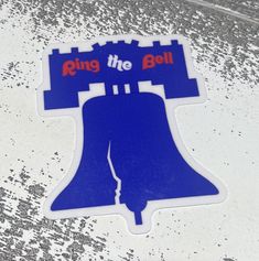 a blue sticker that says ring the bell