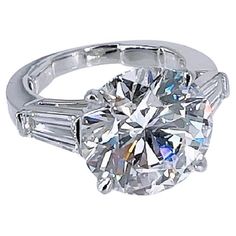 a diamond ring with baguetts on the side