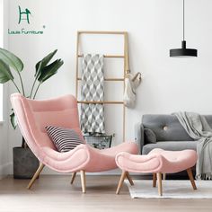 a living room with two chairs and a rug on the floor, in front of a white wall