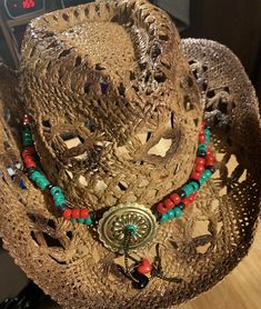 Red, Black, and Green beads. Concho has beaded fringe. The tie is long enough some may be able to wear it as a belt, about 48" The hat shown is not for sale. Adjustable Red Festival Hat, Red Beaded Festival Hat, Red Adjustable Hat Bands For Country Events, Bohemian Red Hat Bands For Festival, Red Adjustable Country Hat Bands, Red Bohemian Hat Bands For Festivals, Bohemian Festival Hat Bands In Red, Bohemian Festival Red Hat Bands, Red Bohemian Adjustable Hat