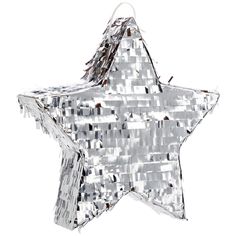 a shiny silver star ornament hanging from a string