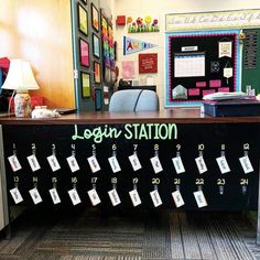 a desk with several notes attached to it and a sign that says login station