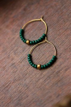 Lovely beaded earrings with green glass seed beads, gold plated stainless steel beads and gold tone stainless steel round hoop earrings. Earring hooks are from nickel free and lead free metal. Perfect jewelry for everyday wear or a great gift for someone special! Diameter of hoops is 25 mm Other earrings of my shop you can see here: https://www.etsy.com/shop/NaTavelli?section_id=13757927 Thanks for visit. Green Small Hoop Beaded Earrings With Tiny Beads, Green Tiny Beads Small Hoop Jewelry, Green Small Hoop Jewelry With Tiny Beads, Green Round Jewelry With Tiny Beads, Green Jewelry With Tiny Beads, Brass Beaded Hoop Earrings As Gift, Beaded Brass Hoop Earrings For Gift, Green Dangle Hoop Earrings With Tiny Beads, Green Hoop Earrings With Tiny Beads