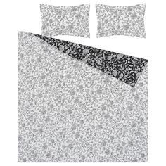 an image of a bed set with black and white floral print on it's sheets