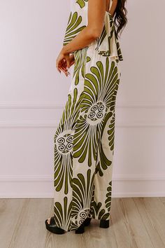 - Indulge yourself in luxe vibes with these sleek and stylish pants! - Material with an abstract print and a satin finish - Built-in shorts style lining - A waistline with an elastic back, a hidden zip fly, and double hook and eye closure - Functional side pockets - A relaxed silhouette that ends in wide hemlines Spring Abstract Print Wide Leg Bottoms, Chic Olive Summer Pants, Summer Wide Leg Bottoms With Abstract Print, Wide Leg Bottoms With Abstract Print For Summer, Chic Abstract Print Pants For Spring, Chic Olive Bottoms For Spring, Olive Pants With Elastic Waistband, Chic Olive Bottoms For Summer, Chic Olive Pants For Spring