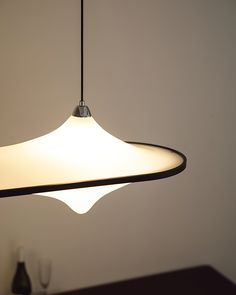 a light hanging from a ceiling in a room