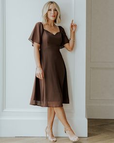 Our cute midi dress is made of lightweight chiffon material and comes in our espresso color. This dress has a smocked back bodice and a sweetheart neckline. Fitted Midi Dress With Ruched Bodice, Elegant V-neck Dress With Smocked Bodice, Chic Bridesmaid Midi Dress With Pleated Bodice, Knee-length Midi Dress With Ruched Bodice For Brunch, Flowy Dress With Smocked Bodice And Sweetheart Neckline, Elegant Midi Dress With Smocked Bodice, Midi Dress With Smocked Back And Fitted Bodice, Fitted Bodice Midi Dress With Smocked Back, Fitted Bodice Smocked Back Midi Dress