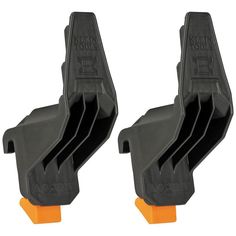 two black and orange plastic clips on white background