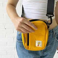 Our new "Daisy" crossbody bag is the perfect everyday accessory. Made from high-quality 16oz washed yellow canvas, this durable bag features an adjustable shoulder strap and multiple compartments to keep all you bits and bobs in-check."Daisy"Retro Inspired Great giftYour new favorite accessory Durable 16oz Washed Yellow CanvasAdjustable Shoulder StrapMultiple Compartments7” X 5” X 2.25”Quick Ship Yellow Canvas Bag With Pockets, Yellow Canvas Shoulder Bag With Removable Pouch, Trendy Yellow Canvas Shoulder Bag, Yellow Canvas Shoulder Bag For Daily Use, Yellow Canvas Shoulder Bag For Everyday, Yellow Shoulder Bag With Pockets, Casual Yellow Canvas Bag With Adjustable Strap, Casual Yellow Shoulder Bag With Zipper Closure, Everyday Yellow Canvas Shoulder Bag