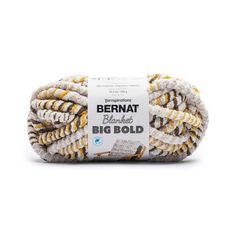 bernat big bold yarn ball in yellow and white with an orange stripe on the side