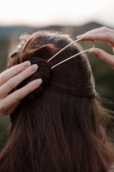 "These handforged bronze hair pins are a nice finishing touch for your updo or topknot bun hairstyle. ** Sold individually.** * They are 4\" or 5\" long and slightly curved to follow the contour of your head. (5\" length, bright bronze shown in photos) * 10 gauge solid wire with flattened top arch, hammer texture on the legs of the pin, (both sides) and rounded ends. * Bright finish Bronze shown. Other metals are available, shown left bottom to top right in the last photo: Bright Copper, Antique Topknot Bun, Long Hair Accessories, Hair Bun Pin, Metal Hair Accessories, Bun Pins, Chignon Bun, Top Knot Bun, Bronze Hair, Bun Holder