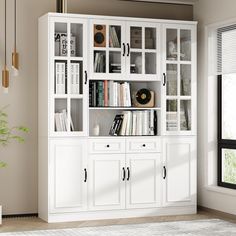 a white bookcase with many books in it