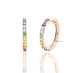 Rainbow sapphire hoop earrings gold | Natural rainbow huggies small earring gold | Rainbow ombre earrings gold | Rainbow sapphire hoops gold EARRING DETAILS : ✦ Earring Diametre : 20MM ✦ Earring Style : Hoops STONE DETAILS : ✦ Stone : Rainbow Sapphire, Amethyst, Garnet, Tanzanite, Topaz, Tourmaline, Peridot ✦ Stone Type : Natural ✦ Stone Size : 2MM ✦ Stone Shape : Round cut ✦ Number of stones : 18 ✦ Stone Weight : 0.50 carats ✦ Stone Grade : AAA METAL DETAILS : ✦ Metal : Solid 14K / 18K Gold ✦ M Rainbow Hypoallergenic Hoop Earrings, Hypoallergenic Rainbow Hoop Earrings, 14k Gold Rainbow Jewelry, Rainbow Colored Round 14k Gold Jewelry, Yellow Gold Gemstone Hoop Earrings For Everyday, 14k Gold Round Rainbow Jewelry, Everyday Yellow Gold Hoop Earrings With Gemstone, Everyday Rainbow Round Jewelry, Fine Jewelry Multicolor Hoop Earrings