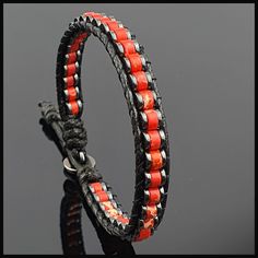 This handmade natural gemstone bracelet made with 2*4 mm roundel red variscite with 1*4 mm Hematite. It is a perfect gift for you and all your loved one for all special days. All our designs prepared by hand according to the your given sizes with love. Wrap is durable 1,5 mm polyester black rope. For closure of our high quality bracelet we used zamak alloys button with 2 optional closure buttonhole. We offer 8 size option between 5.9-8.7 inches (15-22 cm) , please DM us to demand different wrist size. Used Materials; 4*2 mm red variscite 4*1 mm hematite 1 cm zamak alloys button 1.5 mm black korean rope ☆ABOUT US☆ https://www.etsy.com/shop/SevenArtJewelry?ref=listing-shop2-all-items-count#about ☆OUR POLICIES☆ https://www.etsy.com/shop/sevenartjewelry#policies Thanks for your visit Seven Art Red Bracelets With Natural Stones, Red Bracelets With Natural Round Beads, Red Bracelets With Natural Stones And Round Beads, Adjustable Leather Bracelet With Round Beads As Gift, Adjustable Leather Bracelet With Round Beads For Gift, Red Adjustable Leather Bracelet, Bohemian Style, Gift Red Coral Bracelet With Gemstone Beads, Handmade Adjustable Red Leather Bracelet, Natural Stones Leather Bracelet Gift