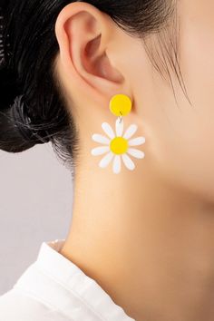 Daisy Drop Earrings: These lightweight acrylic daisy drop earrings make the perfect 90s throwback accessory! Made of white and yellow acrylic with push pack posts to keep them secure.Length: 1 inches x 1.5 inches White Flower-shaped Trendy Earrings, Trendy White Flower-shaped Earrings, Trendy White Plastic Earrings, Trendy White Daisy Shaped Jewelry, Trendy White Daisy-shaped Jewelry, Trendy White Earrings, Retro White Drop Earrings, White Plastic Summer Jewelry, White Plastic Jewelry For Summer