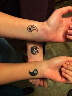 two people with matching tattoos on their arms