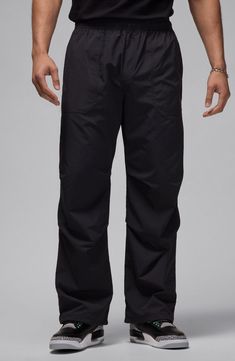 Roomy and relaxed, these all-activity pants made of lightweight nylon sport a trio of handy pockets and a go-anywhere-do-anything vibe. Elastic waist Front slant pockets; back welt pocket 100% nylon Machine wash, line dry Imported Functional Black Nylon Cargo Pants, Black Nylon Functional Cargo Pants, Techwear Parachute Pants With Functional Pockets For Sports, Urban Style Nylon Pants For Outdoor Activities, Black Nylon Activewear With Pockets, Waterproof Nylon Athleisure Bottoms, Utility Nylon Parachute Pants For Sports, Black Nylon Cargo Pants For Outdoor Activities, Black Nylon Cargo Pants For Sports