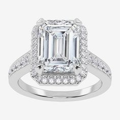 an emerald cut diamond ring with diamonds around it