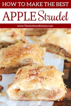 an apple strudel is cut in half and sitting on top of parchment paper