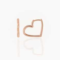 Elevate your everyday style with a touch of love! Our Heart Huggie Hoop Earrings are designed to wrap your ears in elegance and affection. Available in luxurious 14K Gold options, these hoops are your go-to accessory for any occasion! Solid 14k Yellow, Rose and White Gold Hinge closure design Sold as a pair 15mm x 15mm Closure Design, Huggie Hoop Earrings, Gold Heart, Yellow Rose, Heart Of Gold, Everyday Style, Gemstone Earrings, Everyday Fashion, Hoop Earrings