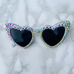 These statement heat shaped oversized sunglasses embellished with Irridescent rhinestones make the perfect gift and statement for a celebration.  There are many styles, designs and colours available, please check my shop! Silver Cat Eye Sunglasses For Summer Party, Party Cat Eye Sunglasses With Mirrored Lenses, Trendy White Cat Eye Sunglasses For Party, Multicolor Party Sunglasses With Uv Protection, Glamorous Party Sunglasses With Bling, White Cat Eye Sunglasses With Gradient Lenses For Party, Trendy Cat Eye Sunglasses For Parties, White Cat Eye Sunglasses With Uv Protection For Parties, Glamorous Party Sunglasses With Gradient Lenses