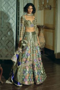 Grey attached cancan lehenga with  zari and zardosi embroidery. Paired with a padded blouse with floral motif embroidery, embellished with pearl tassels and an embroidered dupatta with pearl tassels. - Aza Fashions Fitted Tissue Silk Choli With Intricate Embroidery, Fitted Intricate Embroidery Tissue Silk Choli, Silk Lehenga With Meenakari For Designer Wear, Embroidered Brocade Sets For Reception, Festive Brocade Sets With Intricate Embroidery, Fitted Banarasi Silk Sharara With Intricate Embroidery, Fitted Zari Work Palazzo Set For Reception, Fitted Chanderi Choli With Intricate Embroidery, Reception Brocade Sets With Zari Work