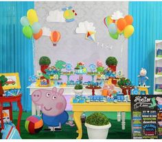 a peppa pig birthday party with balloons and decorations