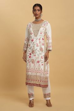 Festive white kurta with floral embroidery. Comes with pant and a dupatta. - Aza Fashions Designer White Churidar With Floral Embroidery, White Churidar With Floral Embroidery For Designer Wear, White Churidar With Floral Embroidery For Designer Occasions, White Floral Embroidered Churidar For Designer Wear, White Churidar With Floral Embroidery For Eid, White Floral Embroidered Salwar Kameez For Diwali, Bollywood Style White Churidar With Floral Embroidery, Semi-stitched White Churidar With Floral Embroidery, White Unstitched Suit With Intricate Embroidery For Reception