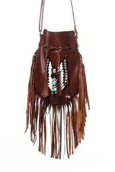 Medium American native style handmade leather bag. Handcrafted bone bead and natural coconut bead embellishment choker attached as decoration Fully lined inside with one pocket. The adjustable leather shoulder strap fits either across the body or slung over your shoulder. Material: leather, cow bones,coconut bead, turquoise crystal bead 8.2 in wide, 11.4 in long. total long include feather fringes 18.9 in aprox 21 cm wide,29 cm long. total long include leather fringes 48 cm aprox Best finishing Natural Leather Bag, Leather Fringe Purse, Boho Leather Bags, Handmade Leather Bag, Fringe Handbags, Cow Bones, Fringe Purse, Fantasy Closet, Turquoise Crystal