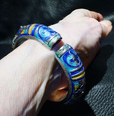 A rare Chinese sterling silver enamel bangle bracelet dating from the Qing Dynasty 1800s. The bangle has beautiful engraving, repousse and chased silver work which has been enameled in areas with cobalt blue, turquoise, and yellow. Minor wear to enamel commensurate with age. Weighs 46.5 grams. Inside diameter 56 mm to fit a small to medium wrist. A very well made and rare piece. Jade Dragon, Enamel Bangle, Dragon Pendant, Morganite Ring, Silver Work, Champagne Diamond, Silver Enamel, Cobalt Blue, Morganite