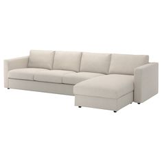 a white sectional sofa with chaise lounge