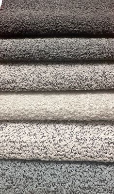 carpet samples are stacked on top of each other