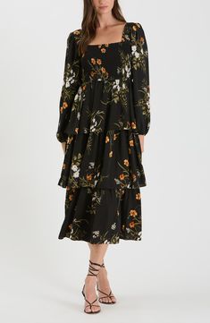 A charming floral print adorns a balloon-sleeve midi dress fashioned with a smocked bodice and fluttery tiered skirt. 49" length Slips on over head Square neck Long sleeves with elastic cuffs Partially lined 97% polyester, 3% spandex Hand wash, dry flat Imported Asian & Pacific Islander Owned/Founded Flowy Floral Print Midi Dress With Puff Sleeves, Black Midi Dresses With Elastic Sleeves, Fall Tiered Skirt Dress With Smocked Cuffs, Modest Floral Print Dress With Puff Sleeves, Flowy Midi Maxi Dress With Floral Print, Tiered Floral Print Midi Dress For Daywear, Tiered Midi Dress With Floral Print For Daywear, Flowy Knee-length Midi Dress With Smocked Cuffs, Billowy Tiered Skirt Dresses For Spring