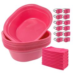 pink party plates and napkins are stacked on top of each other in front of a white background